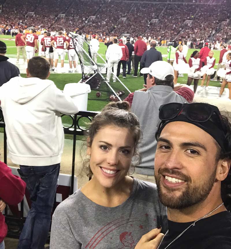 Breland Almadova with his wife at an Alabama football game